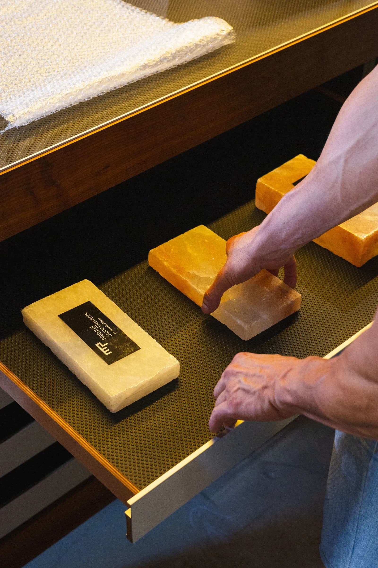 Hands selecting stone samples